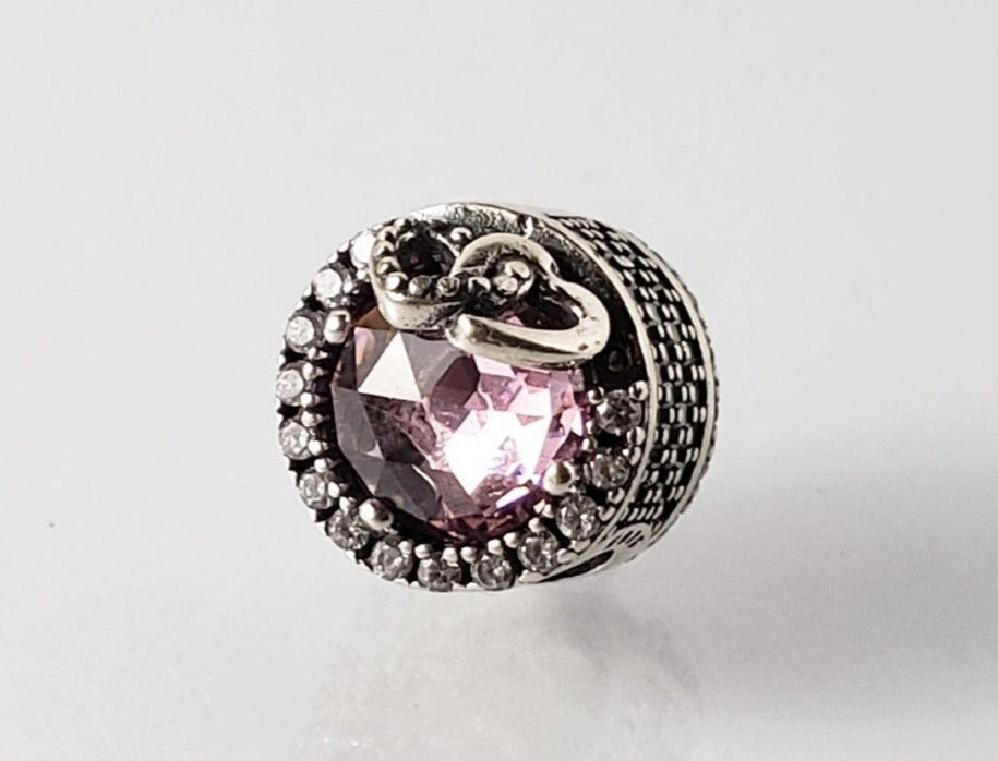 PCHARM2116  CIRCULAR CON PIEDRA ROSA Y CIRCONES TRANSPARENTES AL REDEDOR