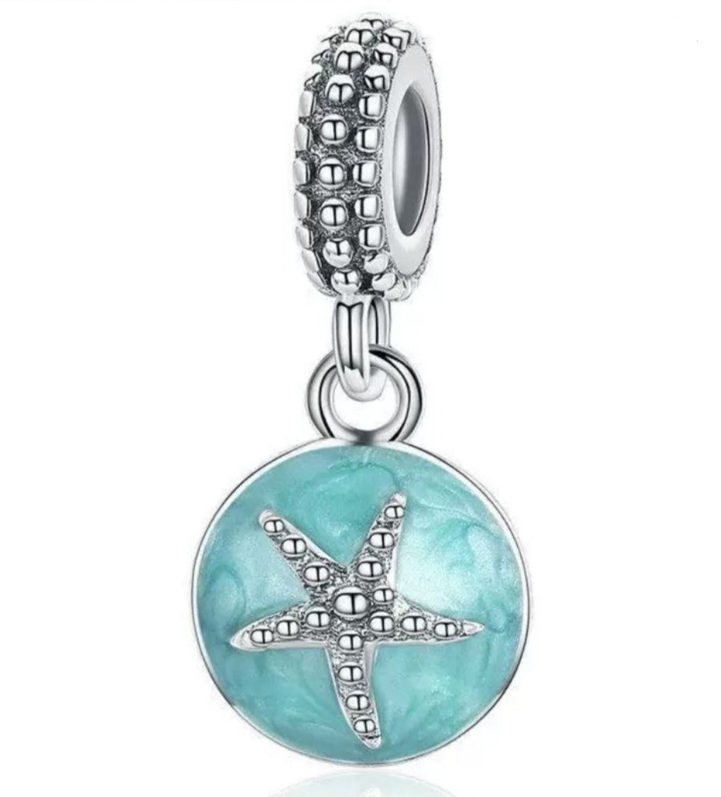PCHARM2768  COLGANTE CIRCULAR CON UNA ESTRELLA DE MAR EN MEDIO